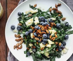 KALE SALAD WITH BLUEBERRIES, MANCHEGO AND PUMPKIN SEED CLUSTERS